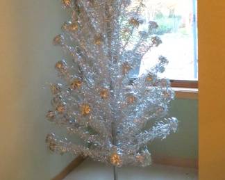Fabulous vintage aluminum tree with pom poms and color wheel.