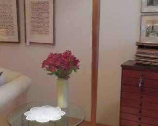 Torchiere lamp and glass side table.