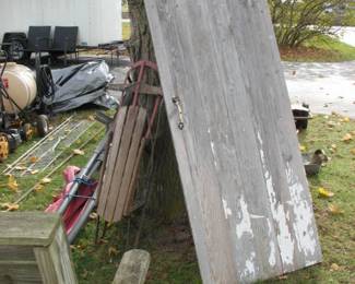 one of several old doors, vintage sled