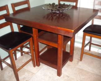 Tall table and 4 chairs with minor chew damage on chair rungs