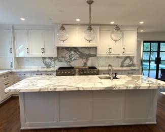 Beautiful Kitchen with White Cabinets & Marble Countertops