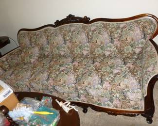 Wood trimmed antique sofa