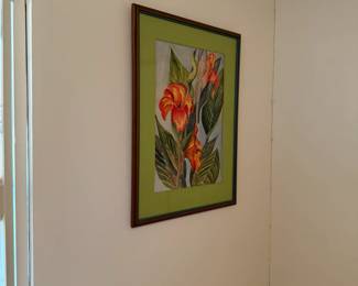 Framed print of bold red and orange tropical blooms