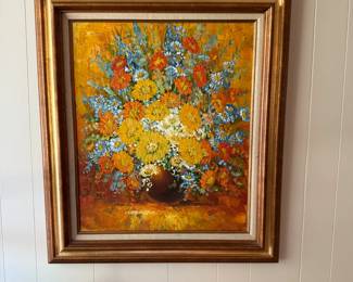 Vibrant textured oil painting of colorful flowers in vase, set in gold frame. Eye-catching piece full of color and charm.
