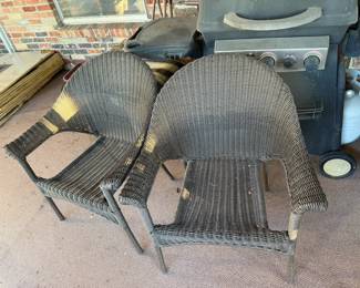 Set of two woven wicker patio chairs