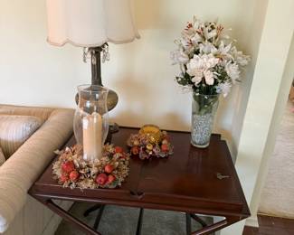 Mahogany Mid-century inspired folding-leg accent table, brass-trimmed lamp, candle décor, and floral decor for all the holidays!
