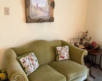 Green Velvet Loveseat with Accent Pillows:
Vintage green velvet loveseat with rolled arms and floral embroidered pillows. Excellent condition with timeless charm. Original custom paintings and artwork throughout the house! 3 tier stacking Mahogany tables.