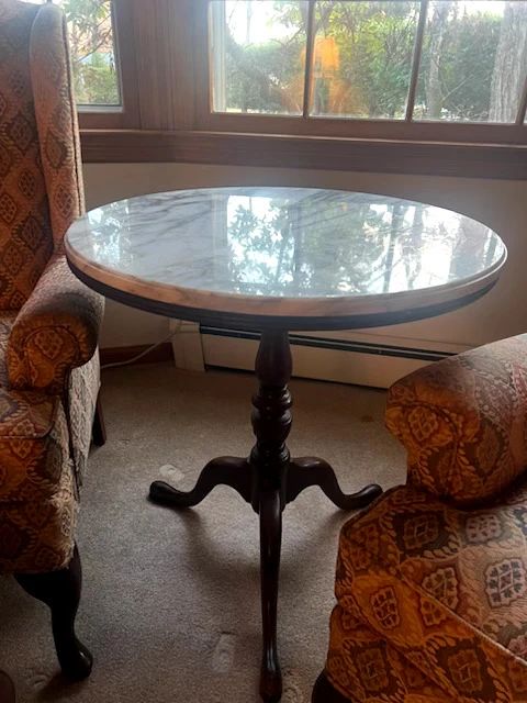 Marble topped round table with solid wood base.