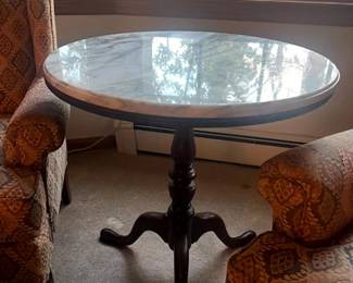 Marble topped round table with solid wood base.