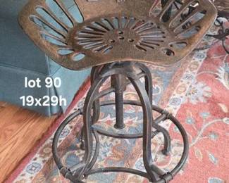 Newer adjustable metal industrial tractor seat stool