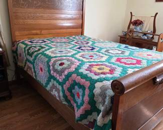 Antique oak full bed and handmade quilt