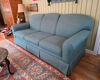 Craftmaster Furniture sofa, area rug and marble top coffee table