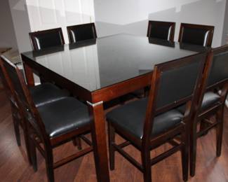 High-top table 8-chairs, self storing leaf & protection glass on top 54” x 37”