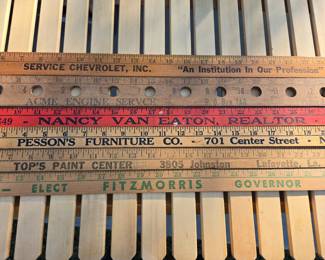 Vintage advertising yardsticks from Lafayette and New Iberia