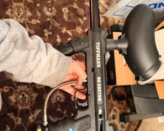 Tippman 98 Custom Paintball gun with 2 bags of paint balls.
