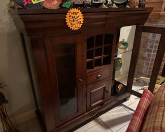 This is a BEAUTIFUL BUFFET. The Angled trim at the top is a pull out Drawer, plus Glass Doors NICE!!!!!