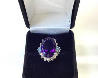 14k Amethyst Ladies Ring This Beautiful 14 Karat 10.14 Gram White Gold Ring Features 10 Carat Oval Amethyst Surrounded By 1 Carat Round Diamonds And 1/2 Carat Blue Diamond Baguettes (stone Weights Are Approximate) Size 6.5