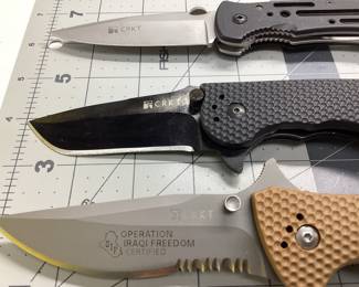 3 CRKT KNIVES LOT THIS LOT FEATURES AN OPERATION IRAQI FREEDOM DESERT CRUISER, POINT GUARD BY CRAWFORD DESIGN, M1 BY GREG LIGHTFOOT AT TACTICAL DESIGN