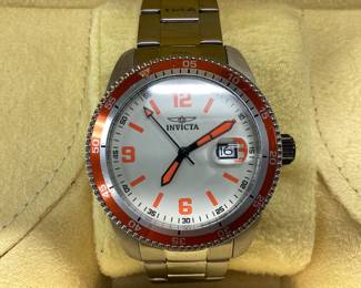 INVICTA 14118 AUTOMATIC THIS WATCH FEATURES ORANGE BEZEL AND ACCENTS AND DATE WINDOW. BAND SHOWS SCRATCHES ON ONE SIDE.