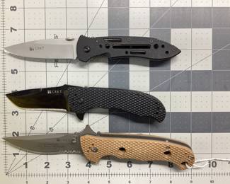 3 CRKT KNIVES LOT THIS LOT FEATURES AN OPERATION IRAQI FREEDOM DESERT CRUISER, POINT GUARD BY CRAWFORD DESIGN, M1 BY GREG LIGHTFOOT AT TACTICAL DESIGN