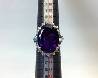 14k Amethyst Ladies Ring This Beautiful 14 Karat 10.14 Gram White Gold Ring Features 10 Carat Oval Amethyst Surrounded By 1 Carat Round Diamonds And 1/2 Carat Blue Diamond Baguettes (stone Weights Are Approximate) Size 6.5