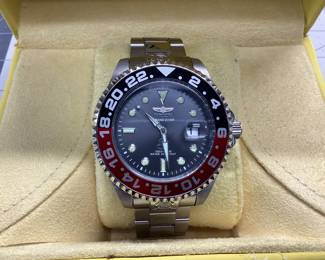 INVICTA 21867 AUTOMATIC THIS WATCH GRAND DIVER FEATURES DATE WINDOW, BLACK AND RED BEZEL. SHOWS LIGHT SIGNS OF WEAR ON STAINLESS BAND