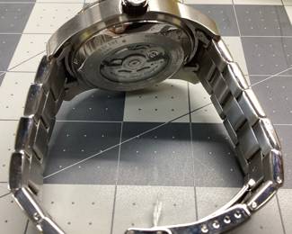 INVICTA 14118 AUTOMATIC THIS WATCH FEATURES ORANGE BEZEL AND ACCENTS AND DATE WINDOW. BAND SHOWS SCRATCHES ON ONE SIDE.