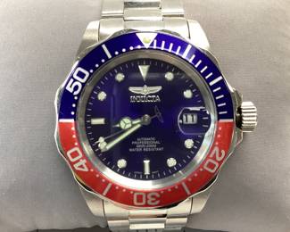 INVICTA 5053 PEPSI BEZEL THIS WATCH FEATURES AUTOMATIC MOVEMENT DATE WINDOW AND PEPSI BEZEL