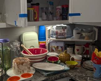 Assorted kitchen ware - serving bowls, coffee mugs, pitchers, decor, utensils, etc