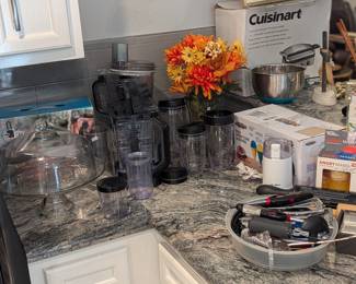 Assorted kitchen devices - Ninja, snow cone maker, and coffee grinder pictured