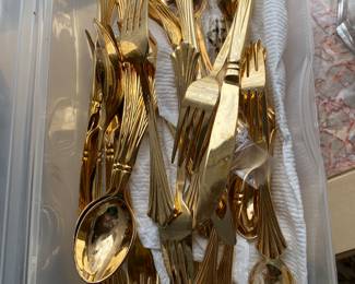Gold tone flatware…
