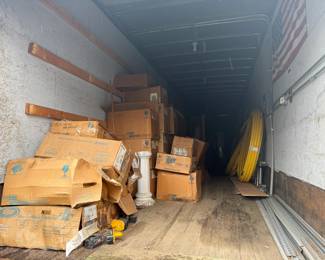 trailer is loaded with NOS toilets, tubs, vanities etc
