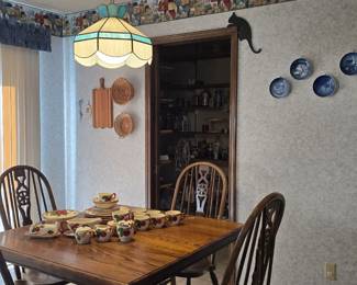 Kitchen pedestal table and chairs and Franciscan Apple dinnerware.