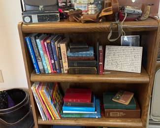 vintage cameras, binoculars, religious books