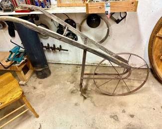 Antique single wheel garden cultivator