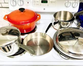 Great like new orange cast iron Dutch oven, and pots and pans