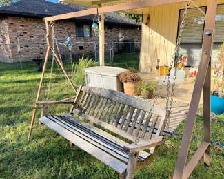 Weathered wood swing on stand