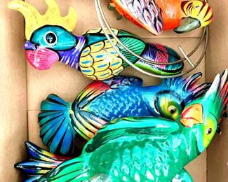 Colorful parrots with hanging rings