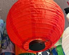 

Bright red round paper lantern with classic ribbed design. Lightweight hanging décor ideal for parties, celebrations, patio lighting, or festive indoor displays.