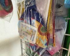 Packaged windsock with bright sunflower-themed design and colorful streamers. Ready-to-hang outdoor décor for porches, gardens, patios, or seasonal displays.