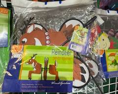 Packaged reindeer wind spinner—cute holiday outdoor décor with spinning wheels, perfect for gardens, porches, or festive yard displays.