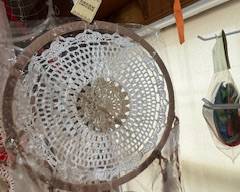 Boho-style double dreamcatcher set with crochet lace centers, natural tones, and long fringe tassels. Beautiful handcrafted wall décor for bedroom or artistic hanging displays.