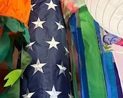 Patriotic Americana windsock with stars and stripes design and long multicolor streamers. Great for outdoor décor, porches, patios, or Fourth of July displays.