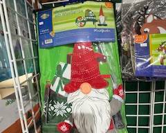 Packaged holiday gnome windsock with festive red hat, snowflake accents, and long white beard. Fun seasonal décor for porches, patios, gardens, or outdoor displays.