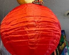 Red paper lantern with cute bear topper, perfect for kids’ rooms, party décor, themed events, or bright hanging decoration indoors or outdoors.