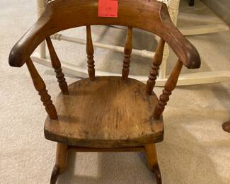 A child’s rocker hand made of solid oak. Brought across the country on a covered wagon.