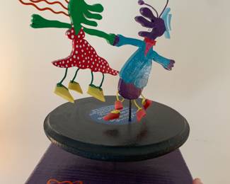 Kinetic sculpture of couple dancing on a record player -figures spin