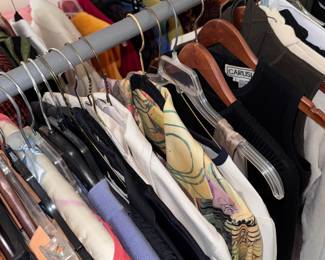 four racks of clothes