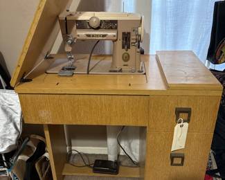 Vintage Singer sewing machine with cabinet 