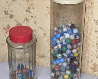 Big container of vintage marbles, smaller container of vintage marble shooters